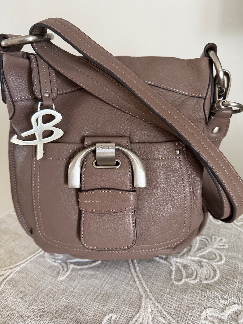 B. Makowsky Taupe-Brown Soft Pebble Leather Bag with front Buckle Detail.